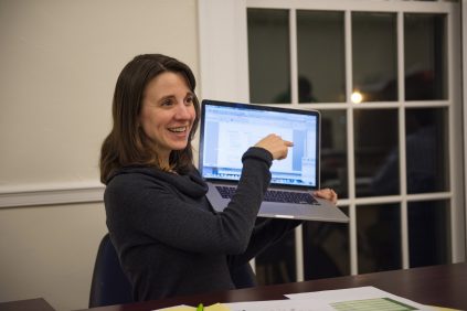 Photo of Michelle Smith holding a laptop