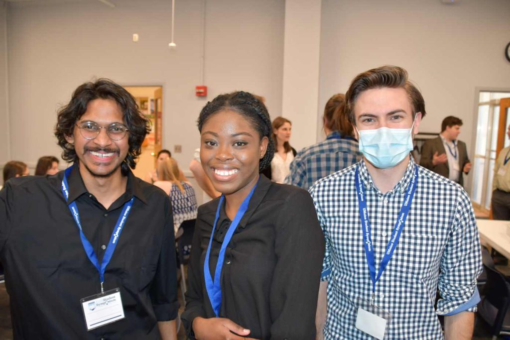 From left, Ph.D. students Shawn David, Hilda Opoku Frempong, and now Alumni, Connor Murphy at UMaine's 2023 Student Symposium.